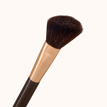 Load image into Gallery viewer, A fluffy angled face makeup brush with a dark brown lacquered handle and a rose gold ferrule, made by mixing handmade synthetic dark brown bristles with a few strands of white bristles.
